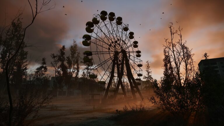 An abandoned Ferris wheel at sunset in the Chornobyl Exclusion Zone